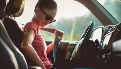Women putting on seat belt